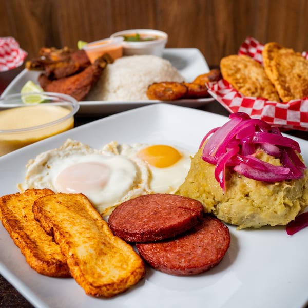 El Cerro's Latin-American breakfast with fried eggs, salami, mofongo with pickled onions, and fried cheese.